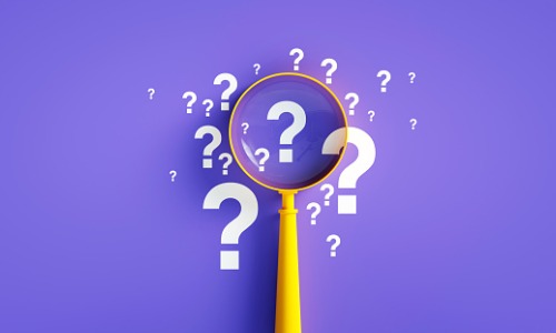 image of a magnifying glass surrounded by question marks